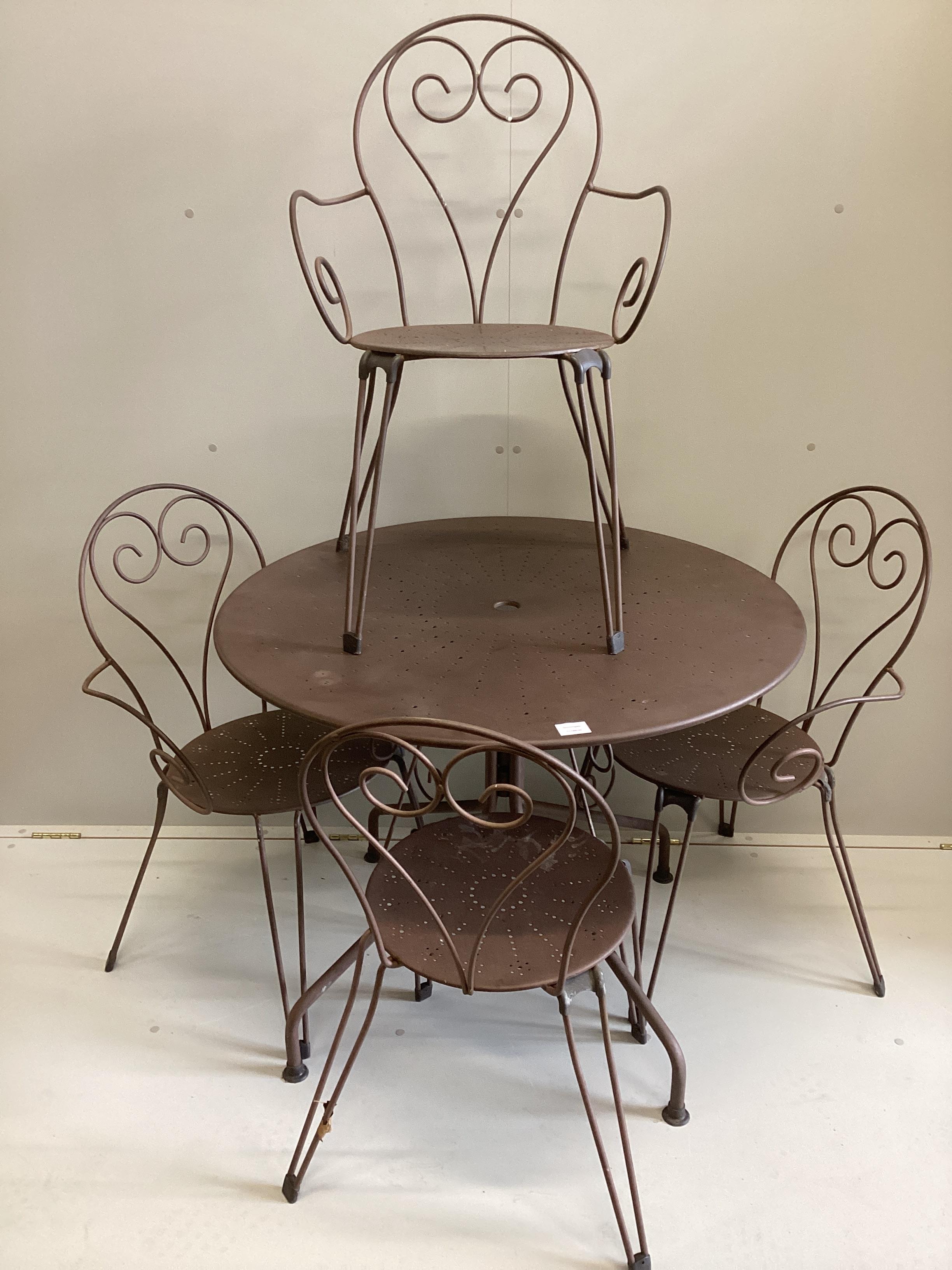 A French circular painted wrought iron table, diameter 94cm, height 75cm together with four matching stacking chairs